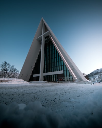 Under the blue sky white wooden church during the day
